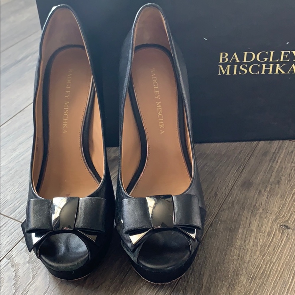 Badgley mischka black leather high pumps.